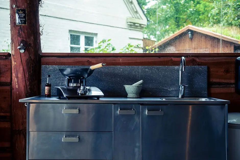 Built-in outdoor kitchen and grill on a patio